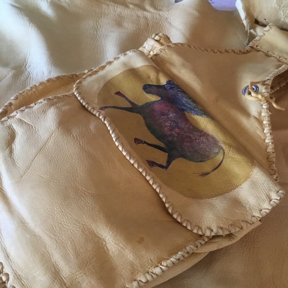 Saddlebags double deerskin hand laced with handpainted “cave dweller” pony